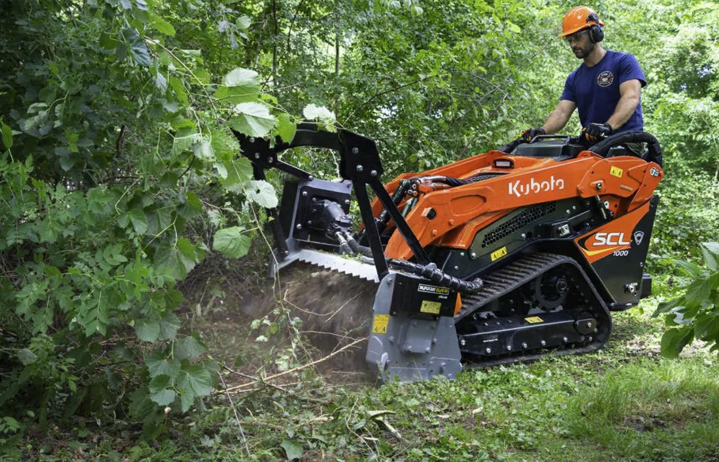 Compact forestry mulching equipment clearing brush on a residential lot in Spotsylvania VA